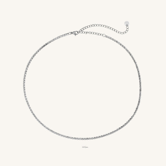 Feine Edelstahl-Tenniskette mit funkelnden Zirkonia und elegantem Glanz von Juwejé.